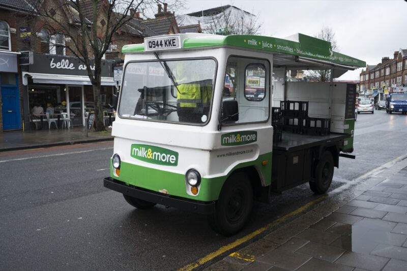 A white and green milk float
